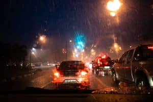 Night driving in rain with hydrophobic coating on windshield enhances visibility, reducing glare from streetlights and vehicles.