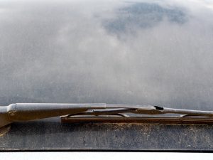 Image of a dirty car windscreen with a wiper blade, illustrating how to clean a car windscreen.