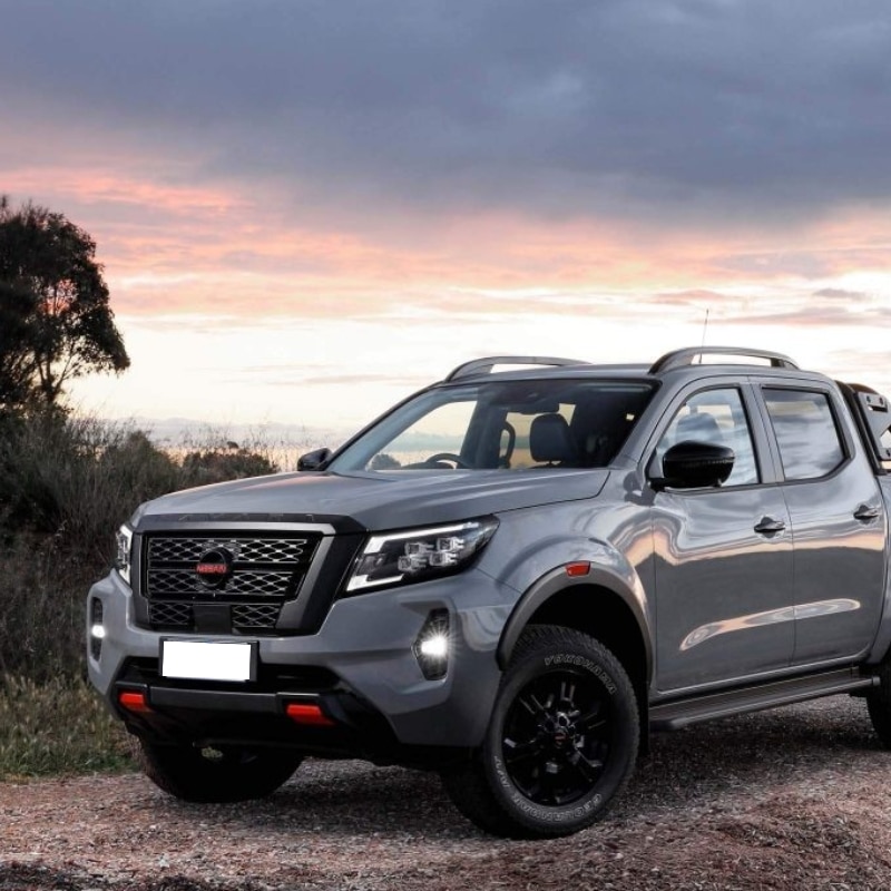 Sleek Nissan Navara with new windscreen at sunset - Nissan Navara windscreen replacement.