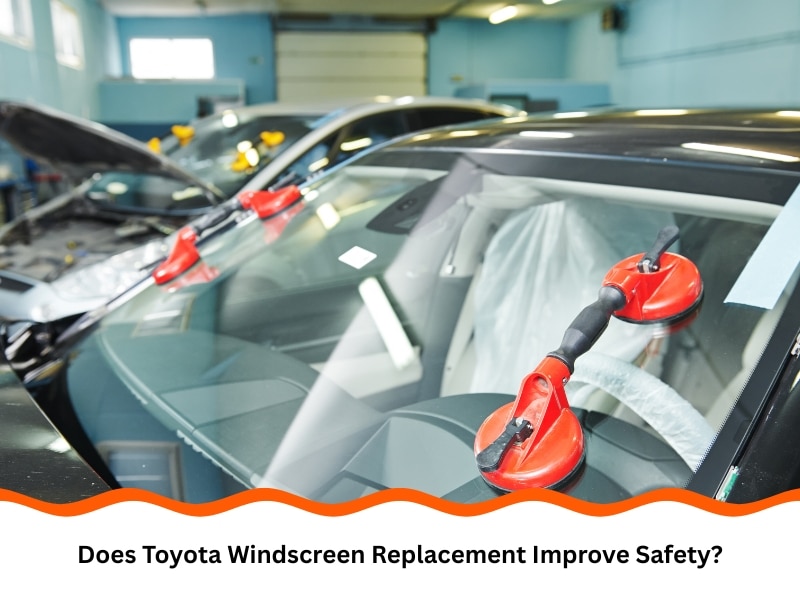 Technician performing Toyota windscreen replacement