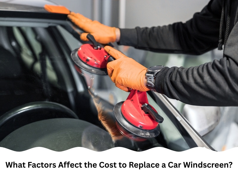 Worker fitting glass with suction tools highlighting cost to replace car windscreen